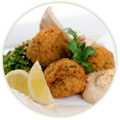 How is falafel served